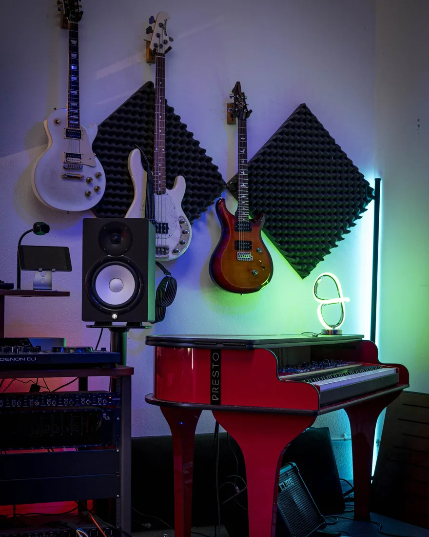 Guitars lined up on the studio wall